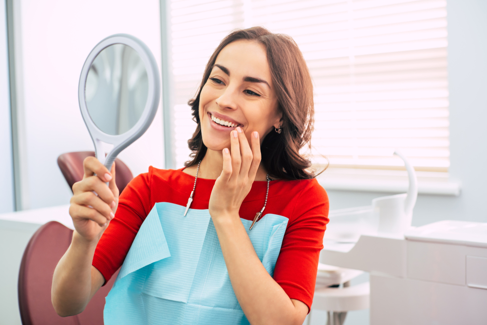 Woman with healthy smile after dental cleaning in Royal Oak, MI