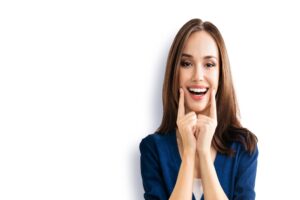 Woman with white smile after veneer treatment in Royal Oak, MI