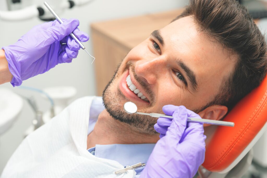 Man relaxing at dental appointment with sedation dentistry in Royal Oak, MI